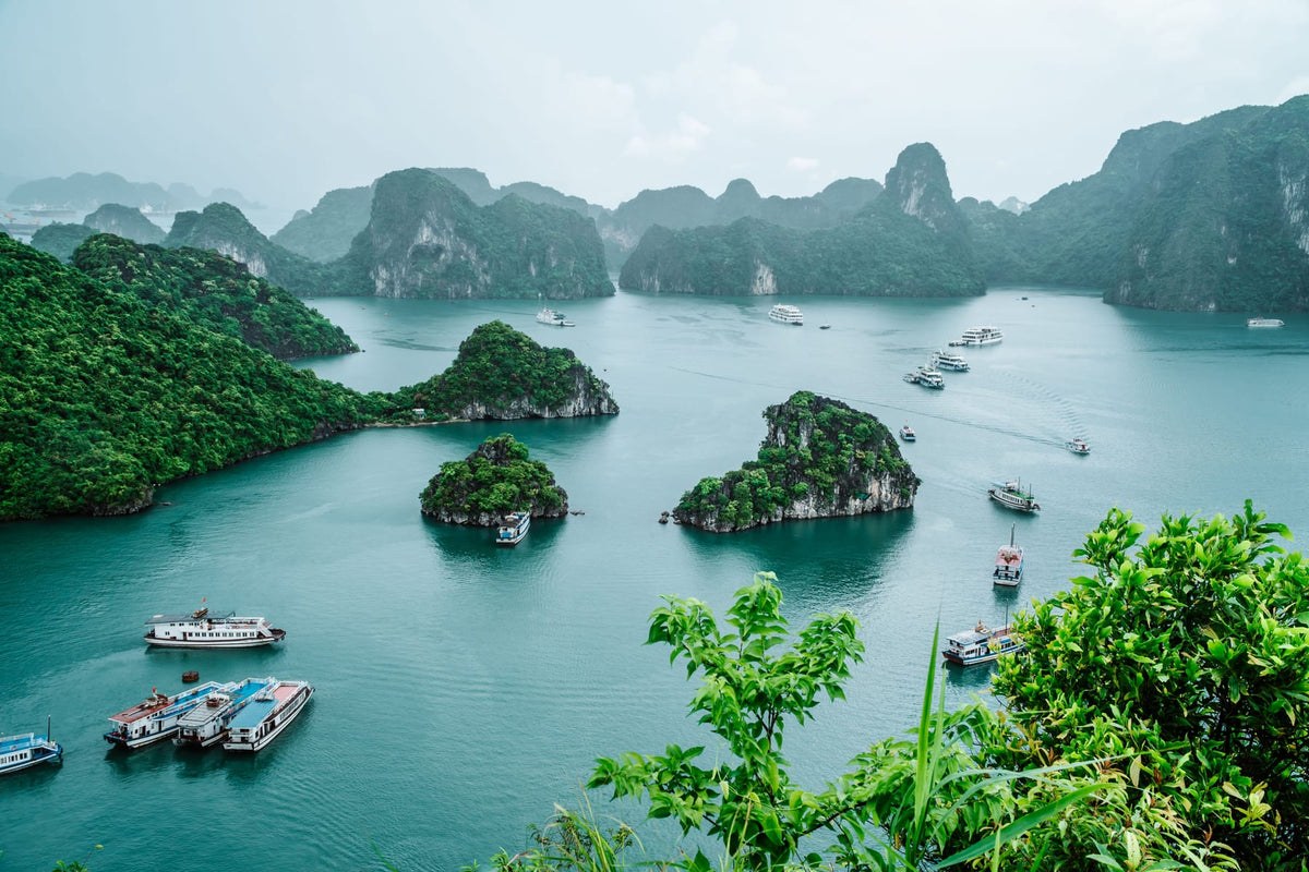 Limestone islands and boats in Ha Long Bay