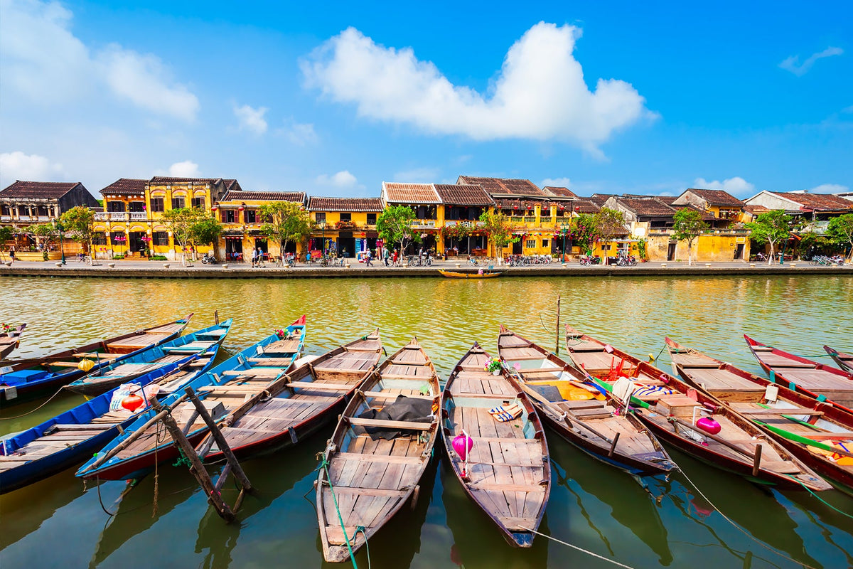 Wooden boats on the Hoai River facing Hoi An Ancient Town